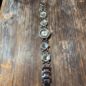 96. Avon Woman’s Quartz Faux Diamond Strap Silver Tone Watch